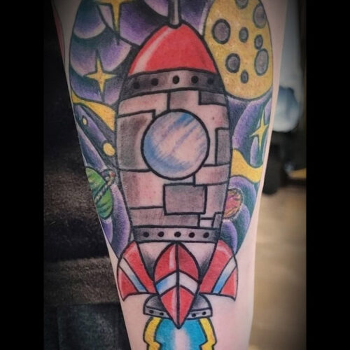 rocket ship tattoo by Chris Dorn at Cactus Tattoo in Mankato