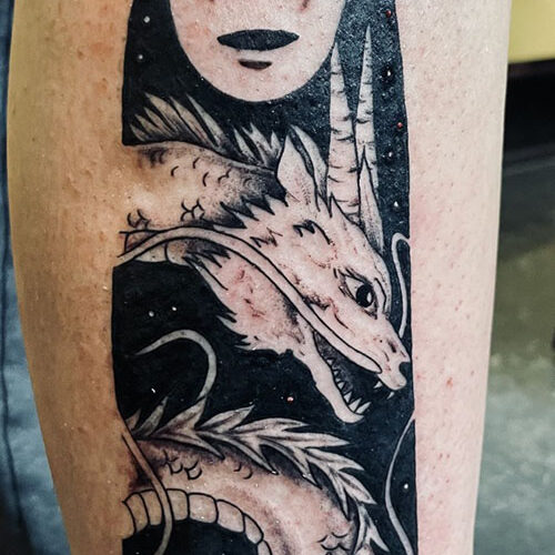Anime tattoo - Spirited Away No Face Dragon in black and gray ink